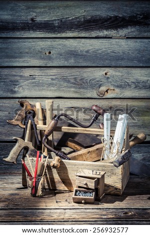 Diagrams and carpentry tools in a old workshop