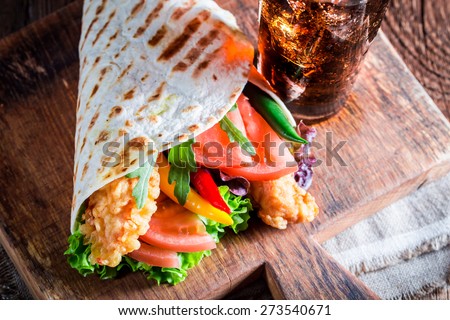Tasty tortilla with vegetables and chicken