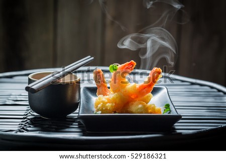 Yummy shrimp in tempura with red sauce