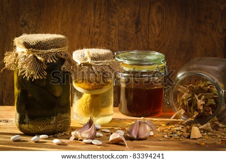 Open jar with vegetables in larder