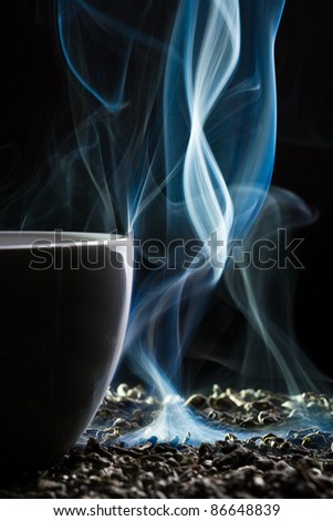 Cup with tea and smoke