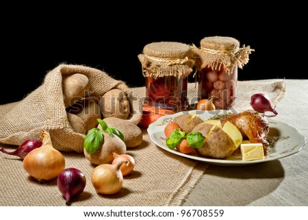 Rural meal with jacket potatoes, roasted meal and vegetables