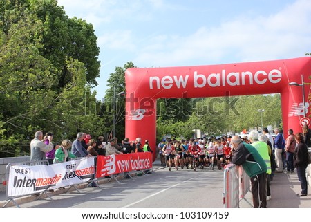 CREST, FRANCE - MAY 13: Runners begin the 11th Half marathon trail challenge in Crest, France on May 13, 2012. The trail half marathon is a nature circuit running through typical landscape of Drome.