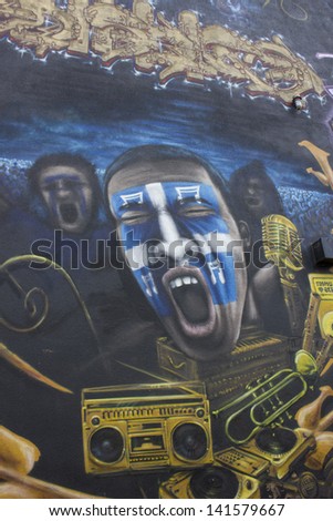 QUEBEC, CANADA-May 5: is year of municipal election in Quebec city. Beautiful graffiti in Quebec city, with young man screaming with quebecian flag maked up in his face on May 5, 2013 in Quebec.