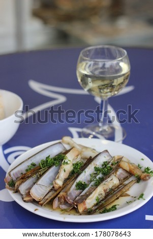 Typical lunch of sunday morning in Bruxelles: Razor shell, clam with garlic, parsley and white wine in Sainte Catherine place, Brussels, Belgium