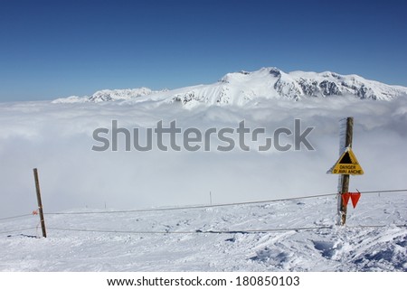 Danger avalanche sign in Alpe du Grand Serre ski resort, Isere, Alps, France, near Grenoble.