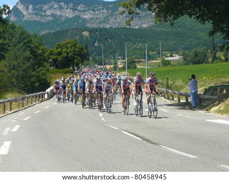 SAOU, FRANCE - JUNE 11: Professional racing cyclists ride in the fifth stage time trial of the UCI World Tour, \