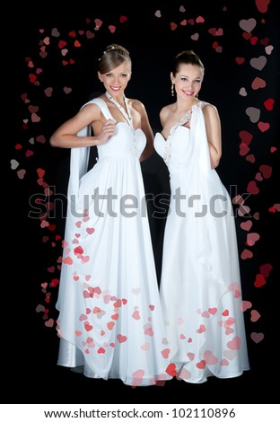 Two of the bride dressed in elegant wedding dresses