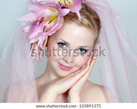 bride with pink lilies in hair