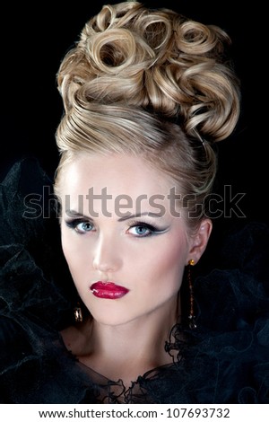 Beautiful woman with evening make-up. Evening hairdress