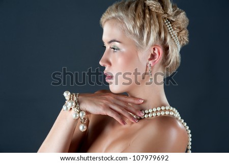 Wedding hairstyle. Bride. Jewelry of pearls