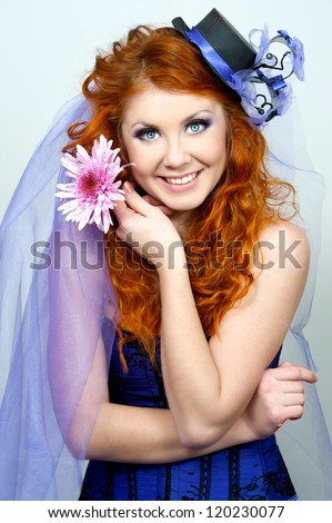 Portrait of a beautiful red-haired girl in a purple hat handmade. Bride