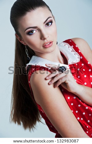 Beautiful woman with evening make-up and evening hairstyle. Jewelry and Beauty. Fashion photo