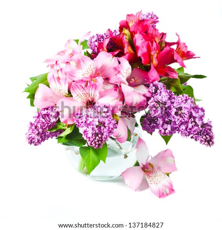 Pink and violet flowers in vase. Lilac and alstroemeria