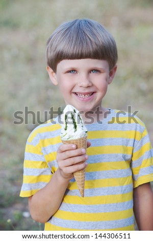 happy child boy eating ice cream