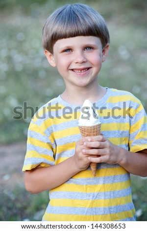happy child boy eating ice cream