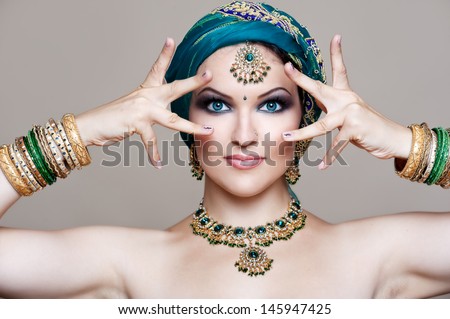 Beautiful Young Indian Woman In Traditional Clothing With Bridal Makeup And Jewelry. Gorgeous Brunette Bride. Girl Bollywood Dancer In Sari. Arabian Bellydancer