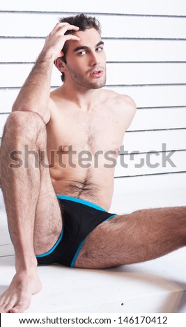 sexy male fitness model in brief shorts