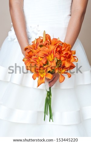 Bride holding wedding bouquet. Wedding bouquet of lilies