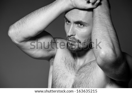 Sexy male model. Black-and-white photo
