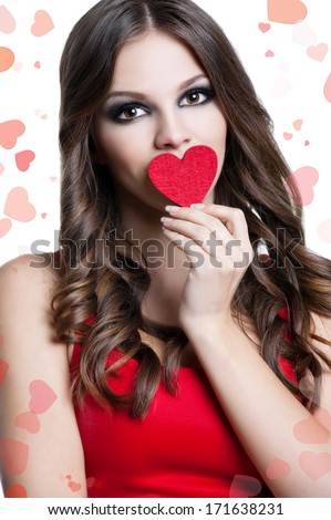 Valentine\'s Day. Beautiful blond woman with heart in his hands. Young woman with red heart on white background