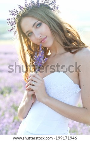 beautiful bride in a lavender field at sunset