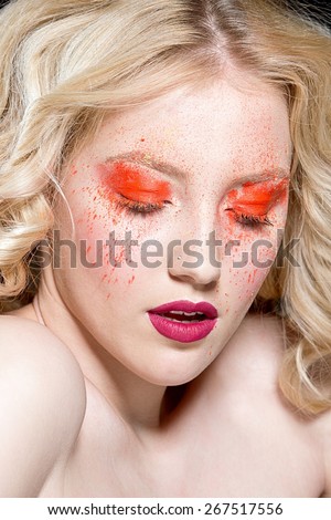 Woman with bright make up. Bright make up with pigment eye shadows