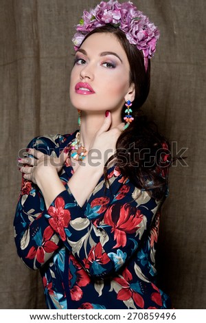 Beautiful brunette woman. Cuban beauty woman with flower wreath