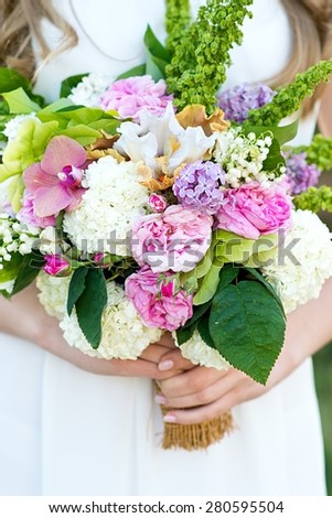 Bouquet in hands. Bride\'s bouquet