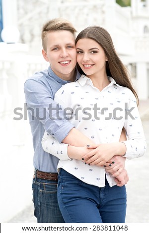Beautiful happy smiling couple in love having fun together end enjoy their love and romantic date. Close up portrait of loving couple