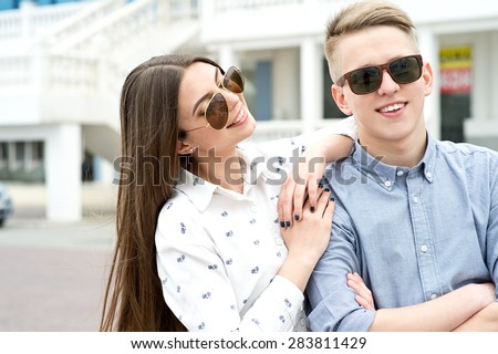 Beautiful happy smiling couple in love having fun together end enjoy their love and romantic date. Close up portrait of loving couple
