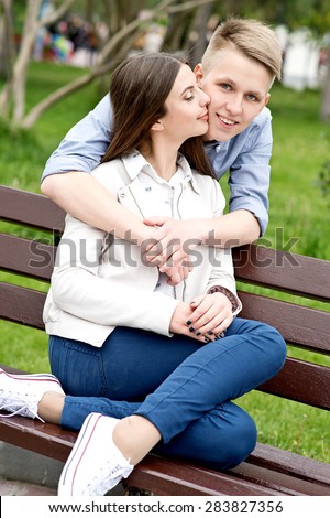 Beautiful happy smiling couple in love having fun together end enjoy their love and romantic date. Close up portrait of loving couple in park.