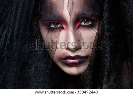 Portrait of a pale gothic vampire woman. Halloween Make up.