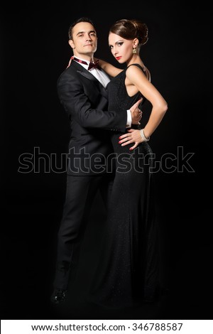 Couple dancing tango.Beautiful young couple in love dancing passionate dance. Studio shot.