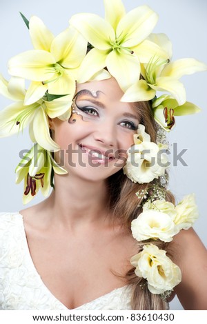 portrait of a beautiful girl with a garland of lilies and eustoma in the head, the bride
