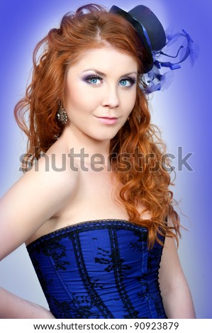 portrait of a beautiful red-haired girl in a purple hat handmade