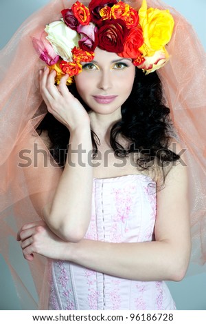 Beautiful woman with  roses flowers in her hair. Bride