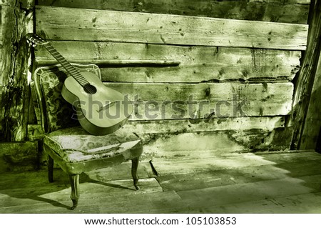 blues guitar the old wooden wall as background horizontal green