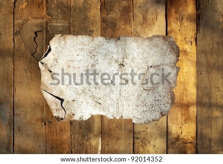 rusty tin plate on wooden background horizontal