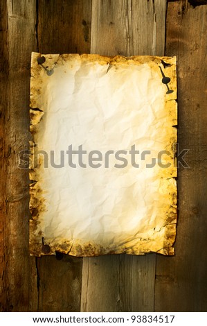 old paper clipped on boards background vertical