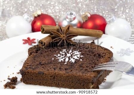 Chocolate truffle cake decorated with red christmas bauble