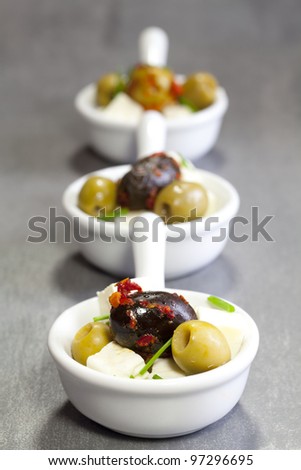 olives with feta cheese in a bowl of porcelain
