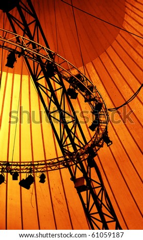 Black stage lights for outdoor performance on orange background