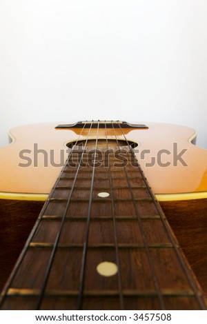 Guitar positioned horizontal to have space at top of image for designers