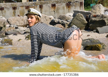 girl on all fours in beach