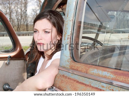 woman in an old car