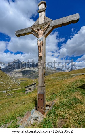 Cross in alpine filed near matterhorn, Zermatt, Switzerland