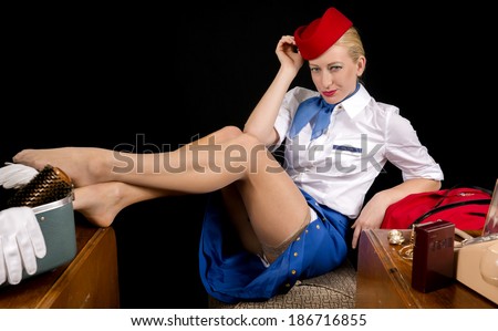 Retro Airline Stewardess or Attendant Posing Provocatively at her Vanity.