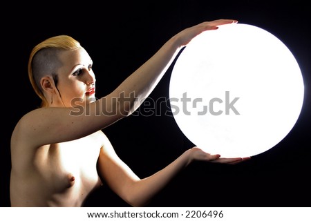 stock photo Goth Girl Nude Holding Glowing Globe