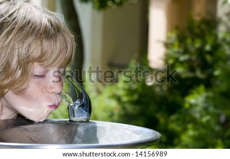 Little Girl (or Boy) slurping at the Drinking Fountain